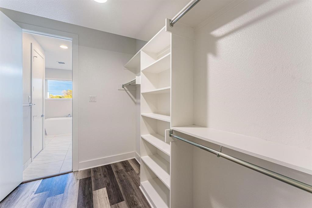 4013 Ivanhoe Lane Dallas, TX 75212 - Photo 20 of 38 Spacious closet featuring dark hardwood / wood-style flooring