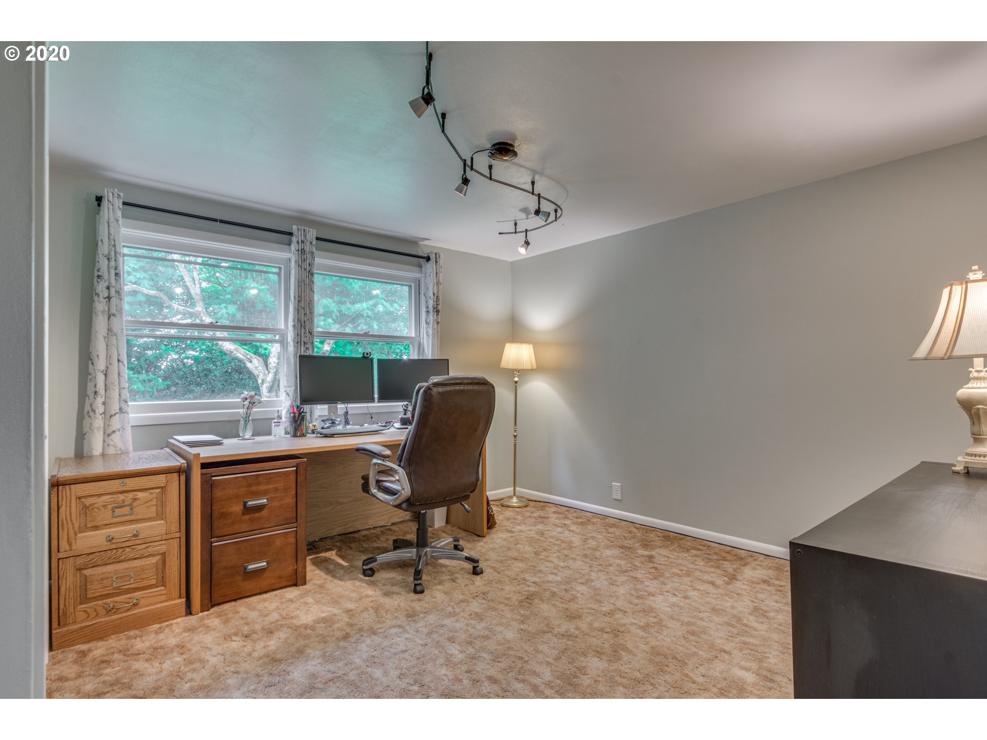 1650 North Royle Road Ridgefield, WA 98642 - Photo 11 of 32 a view of a workspace with furniture and a window