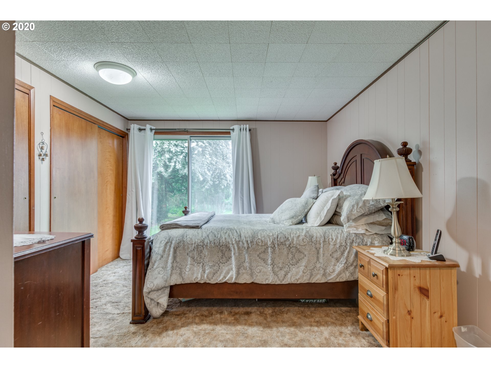 1650 North Royle Road Ridgefield, WA 98642 - Photo 12 of 32 a bedroom with a bed and window
