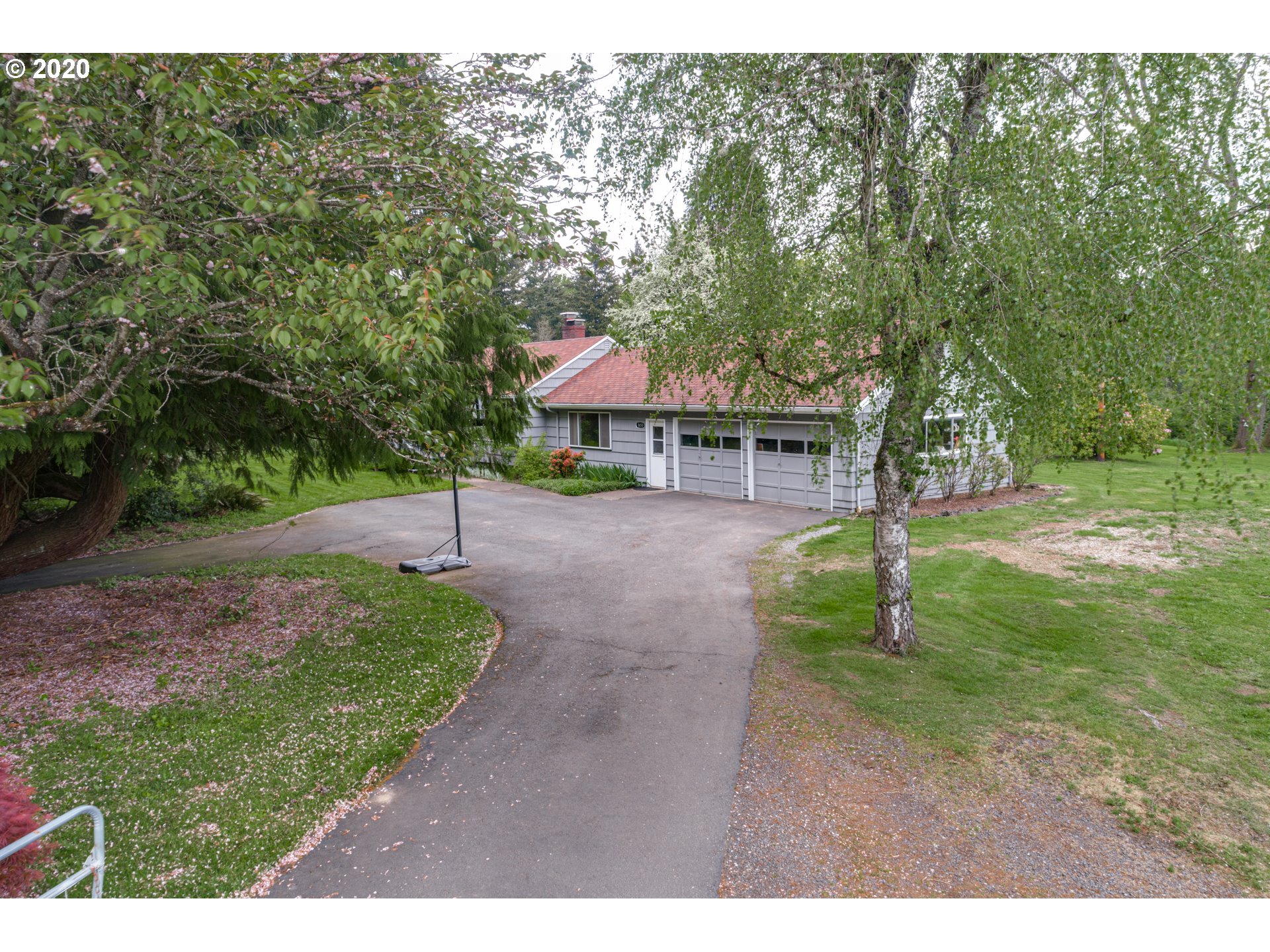 1650 North Royle Road Ridgefield, WA 98642 - Photo 22 of 32 a view of a backyard with a garden and trees