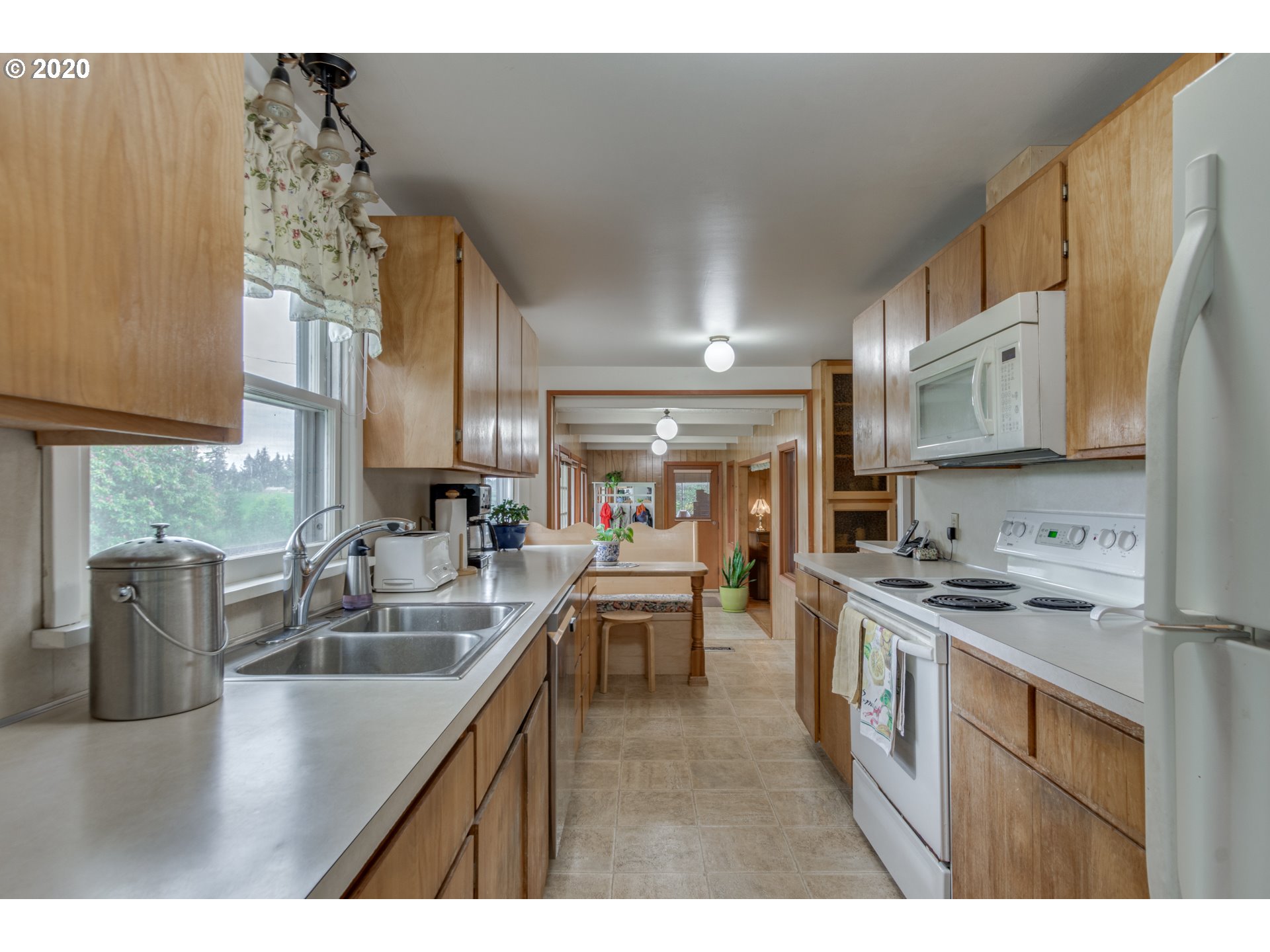 1650 North Royle Road Ridgefield, WA 98642 - Photo 10 of 32 a kitchen with stainless steel appliances granite countertop a sink a stove and cabinets