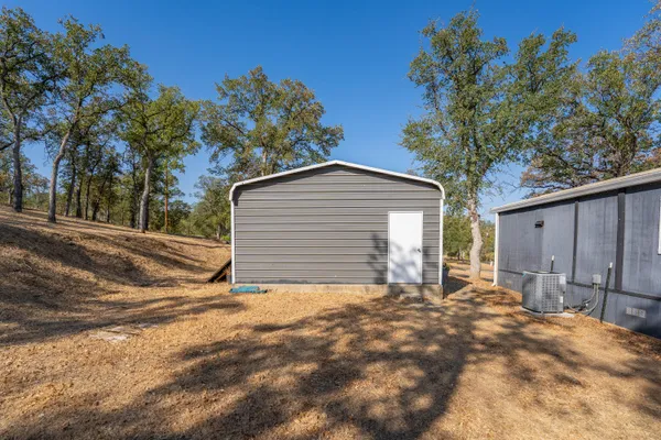 a view of a house with a yard and garage