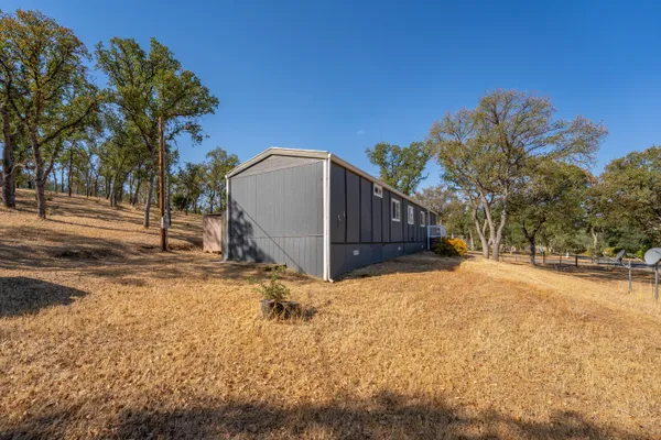 a view of a backyard of the house