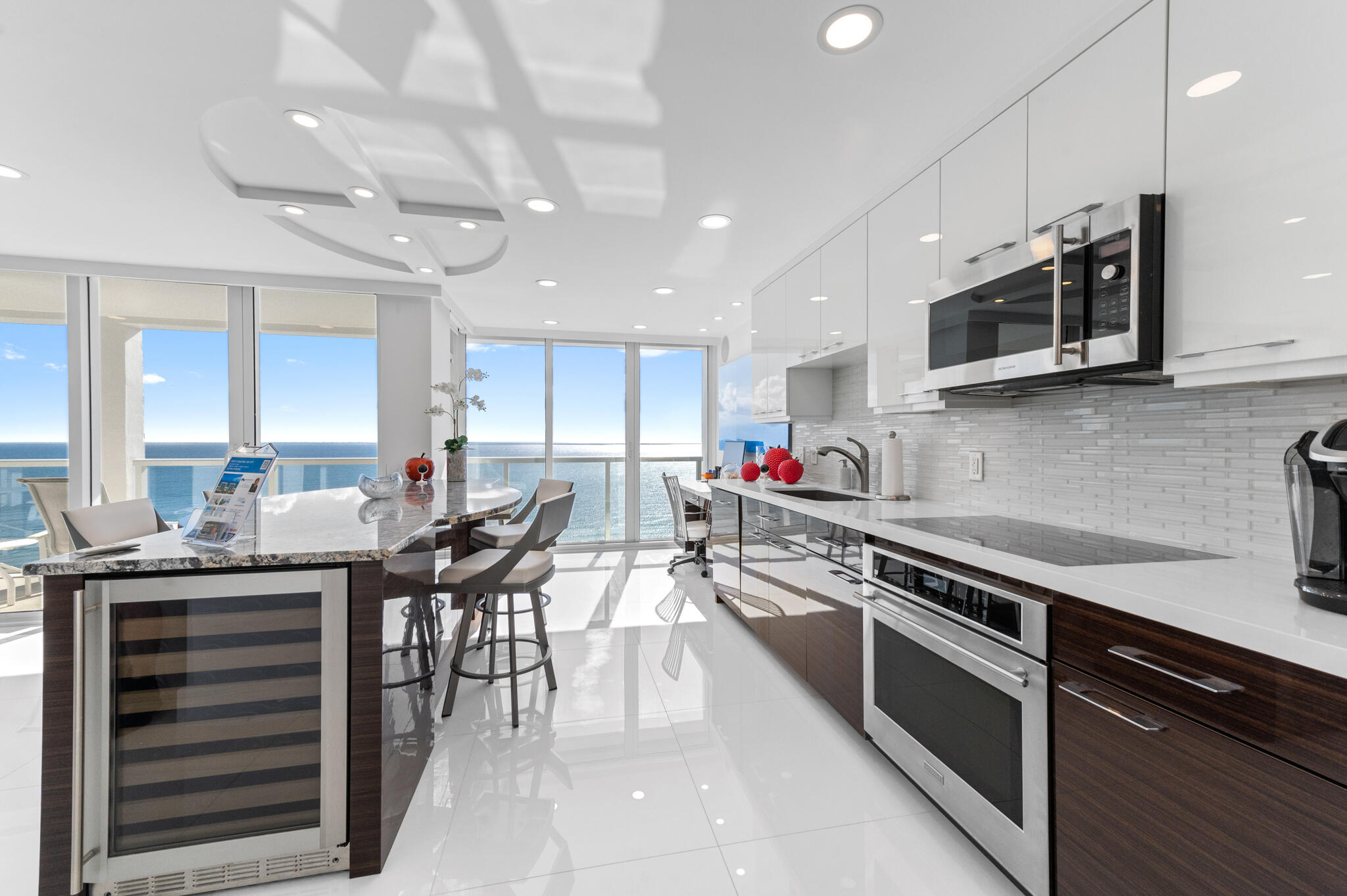 2800 South Ocean Boulevard, Unit 21E Boca Raton, FL 33432 - Photo 13 of 60 a kitchen with stainless steel appliances kitchen island granite countertop a stove sink and cabinets