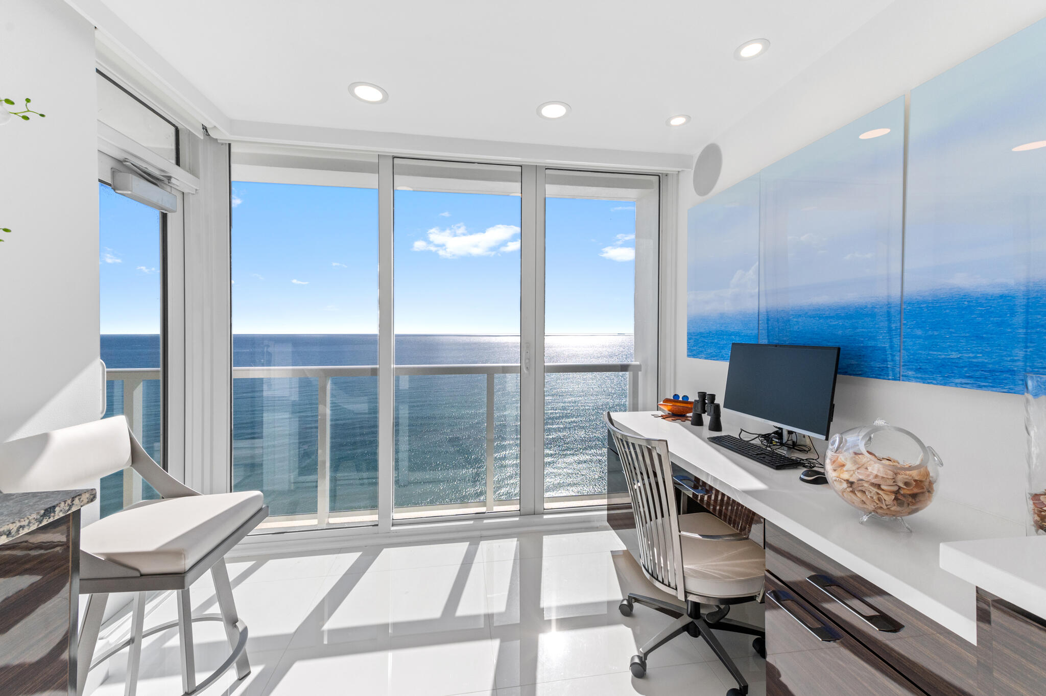 2800 South Ocean Boulevard, Unit 21E Boca Raton, FL 33432 - Photo 14 of 60 a view of workspace with wooden floor and windows