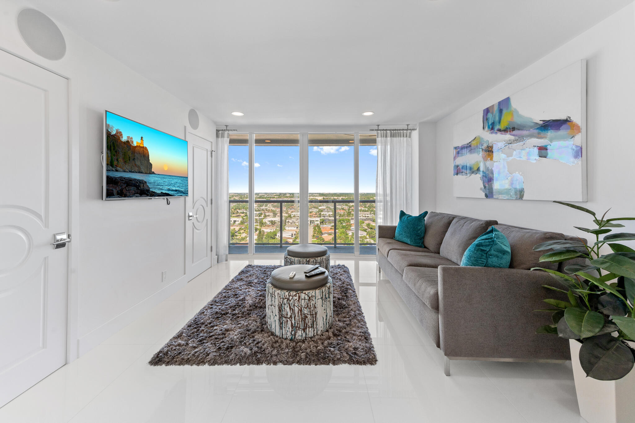 2800 South Ocean Boulevard, Unit 21E Boca Raton, FL 33432 - Photo 17 of 60 a living room with furniture and a flat screen tv