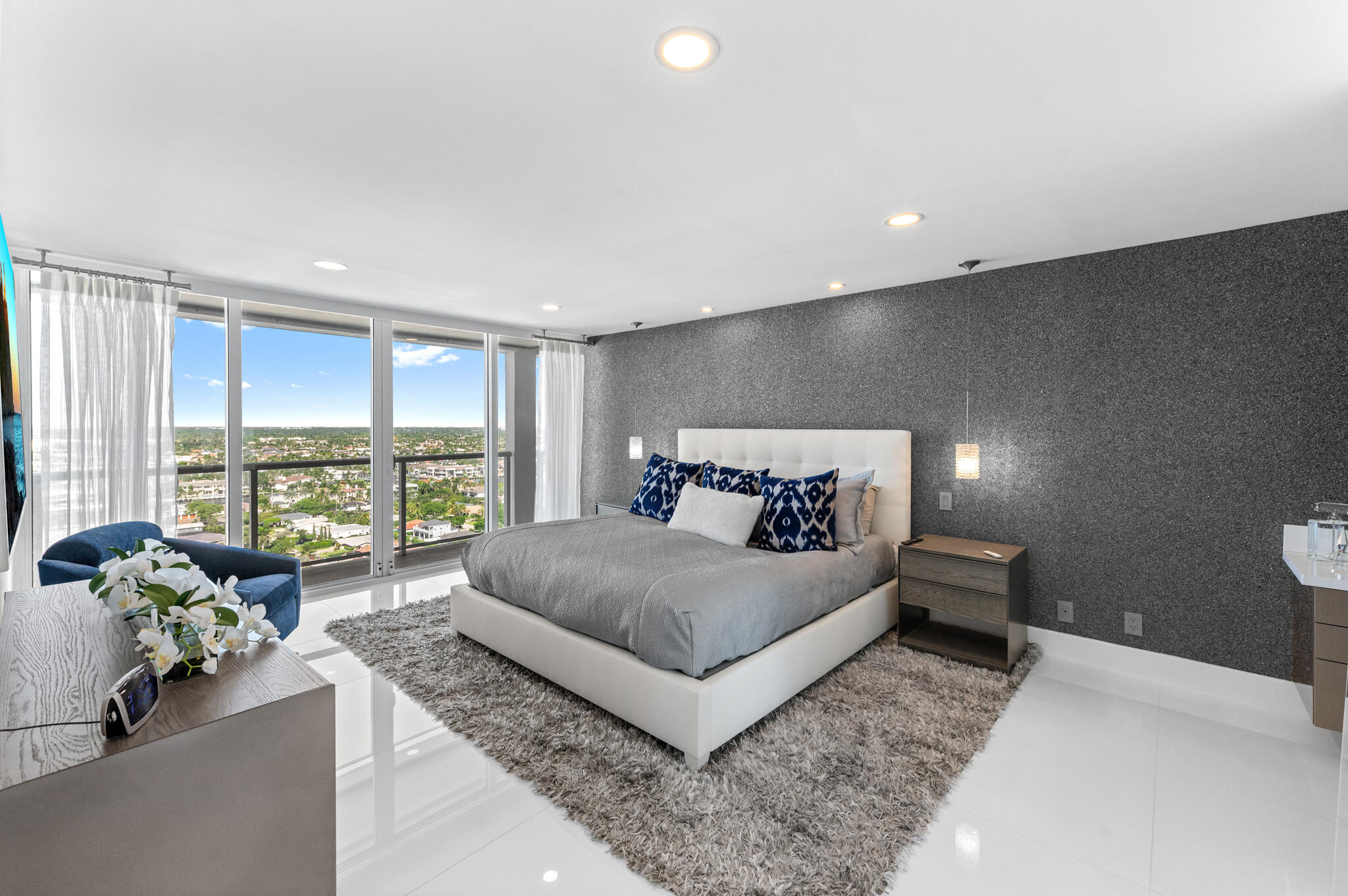 2800 South Ocean Boulevard, Unit 21E Boca Raton, FL 33432 - Photo 21 of 60 a bedroom with a large bed and large windows