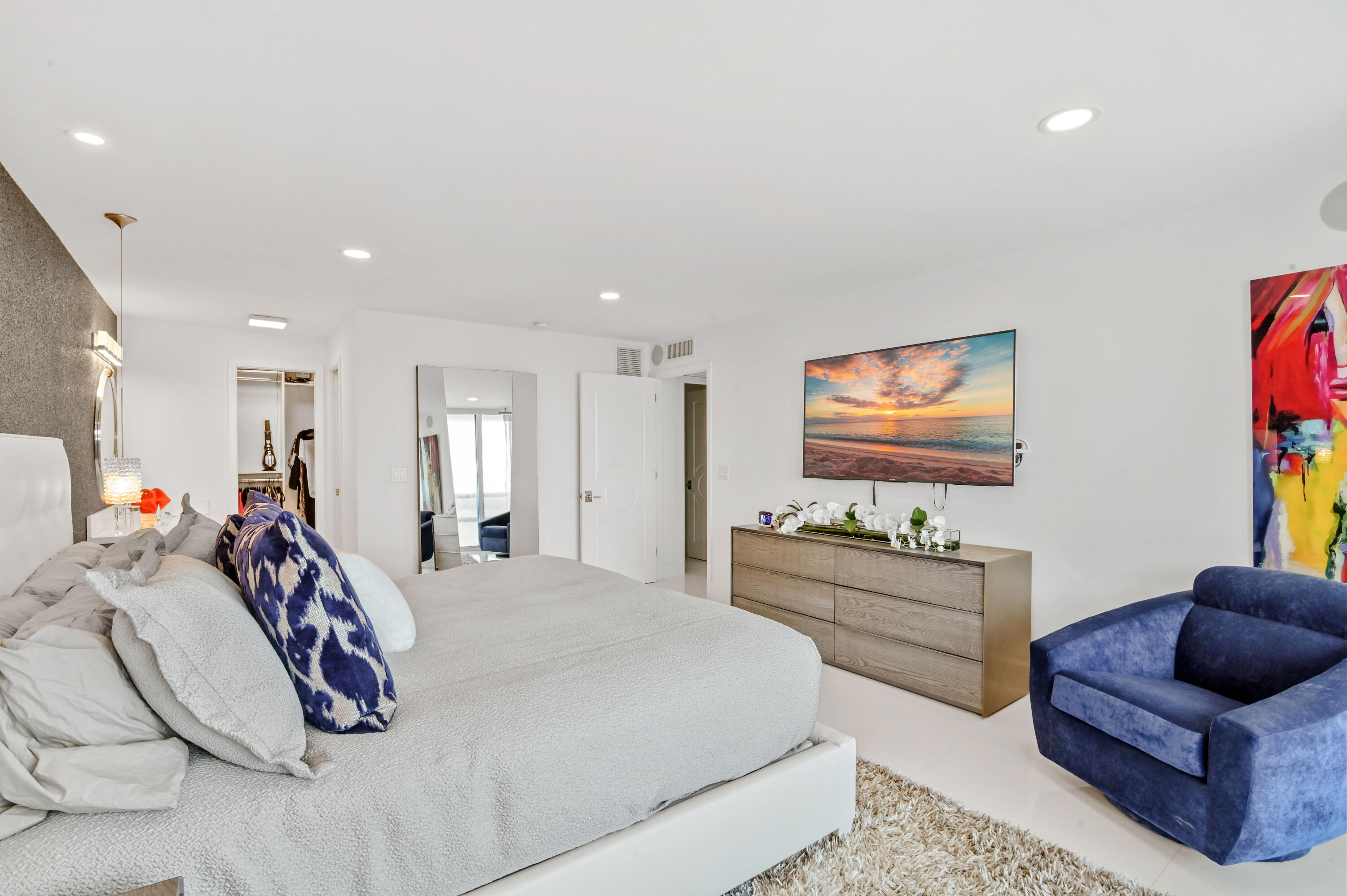 2800 South Ocean Boulevard, Unit 21E Boca Raton, FL 33432 - Photo 22 of 60 a bedroom with furniture and a flat screen tv