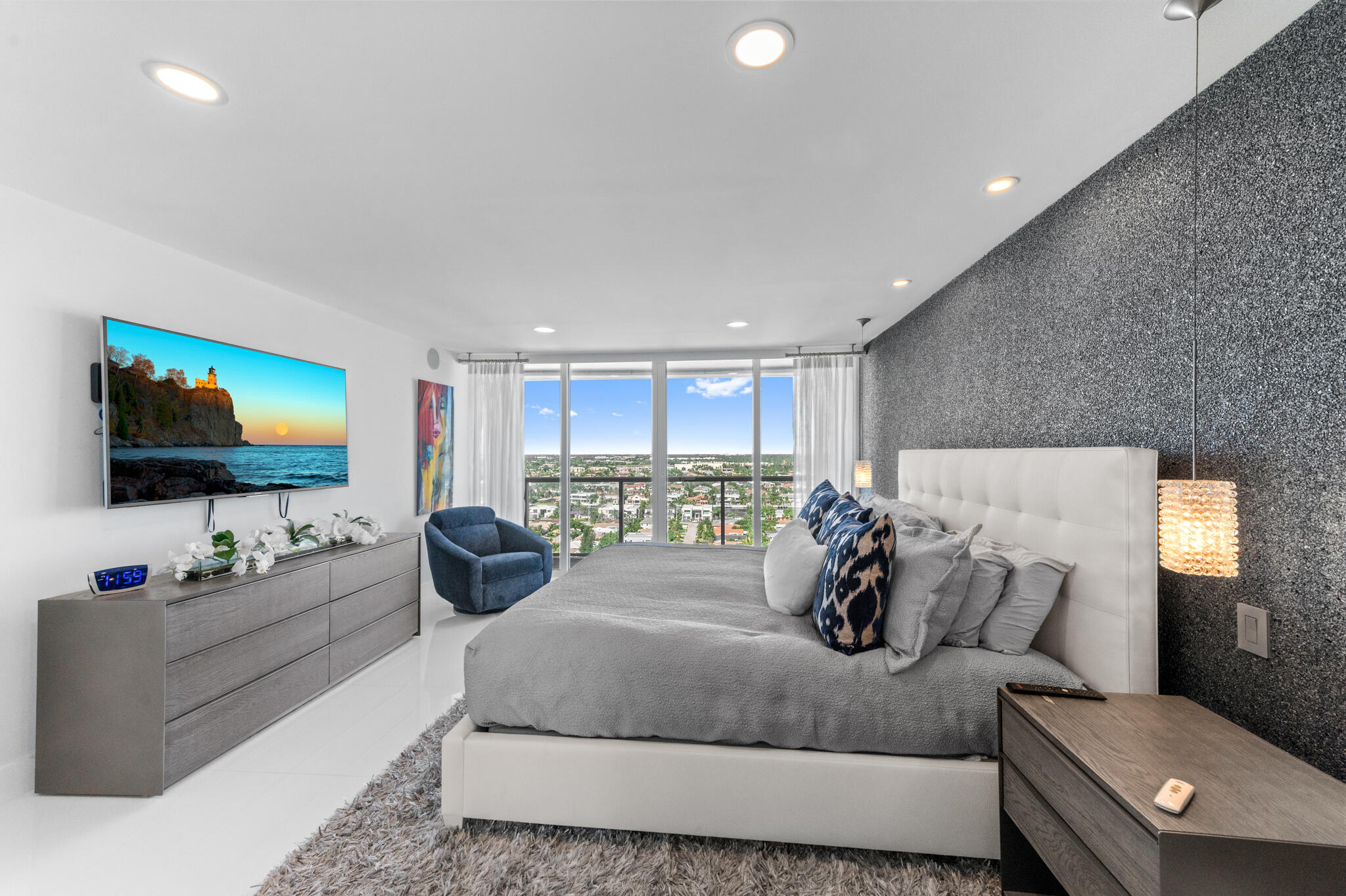 2800 South Ocean Boulevard, Unit 21E Boca Raton, FL 33432 - Photo 24 of 60 a living room with furniture and a flat screen tv