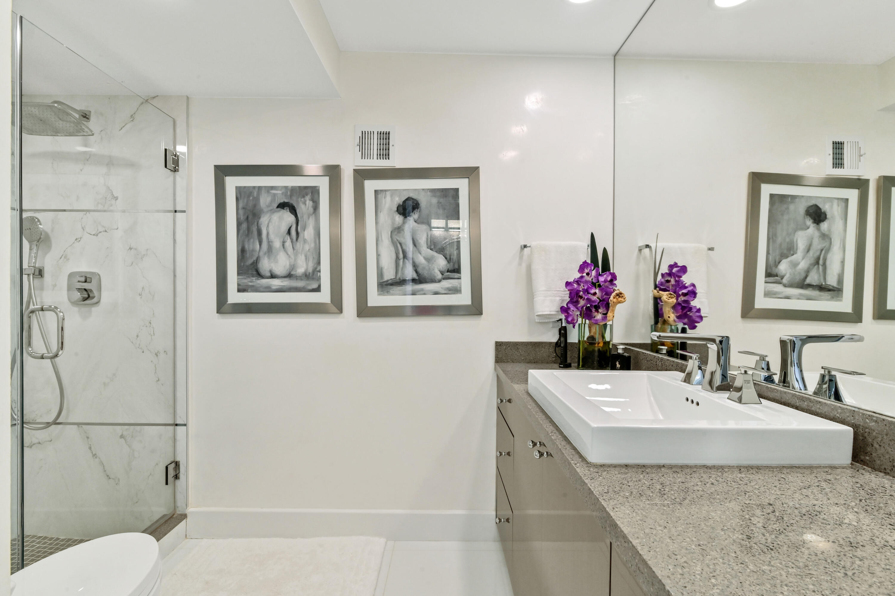 2800 South Ocean Boulevard, Unit 21E Boca Raton, FL 33432 - Photo 28 of 60 a bathroom with a granite countertop sink a mirror and a shower