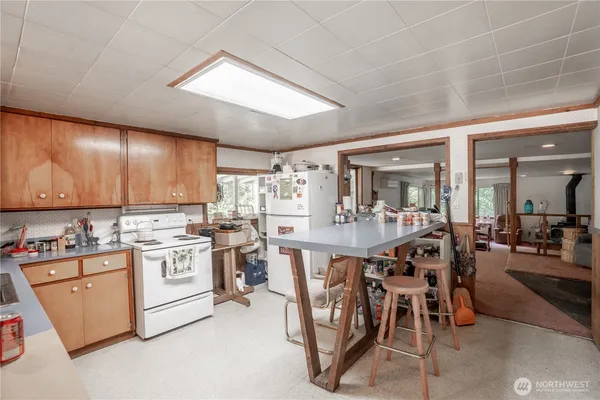 a kitchen with a sink cabinets and window