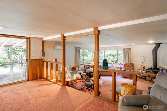 a room with gym equipment and view of living room