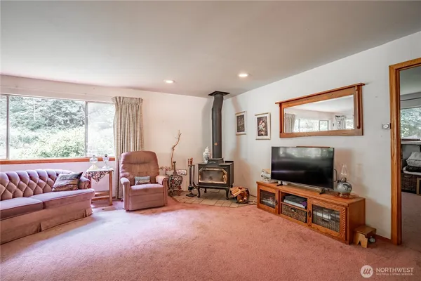 a view of an entryway with workspace and bedroom