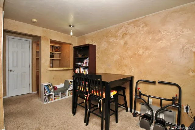 a room with furniture and a fireplace