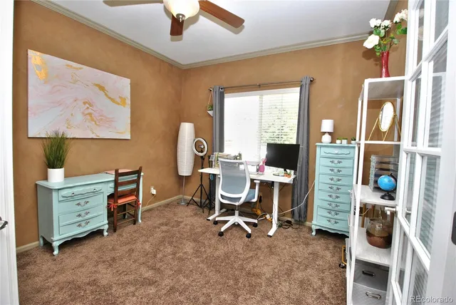 a view of a workspace with furniture