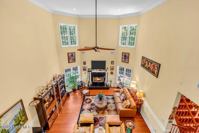 a living room with furniture a dining table and chairs in it