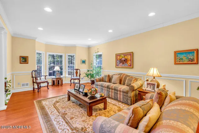 a living room with fireplace furniture and a flat screen tv