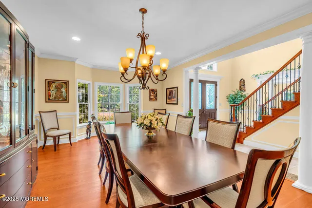 a bedroom with bed and wooden floor