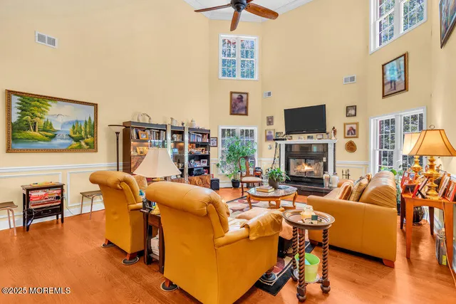a bathroom with a granite countertop shower and a sink