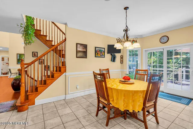 a living room with furniture a ceiling fan and a window
