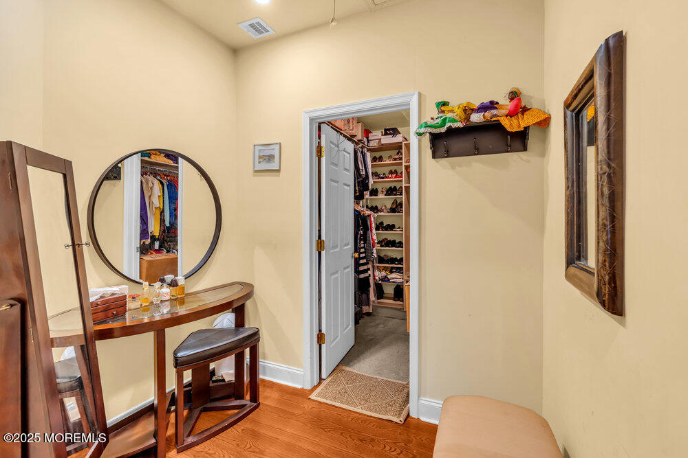 312 Clearstream Road Jackson, NJ 08527 - Photo 45 of 99 a view of walk in closet with clothes and shoes