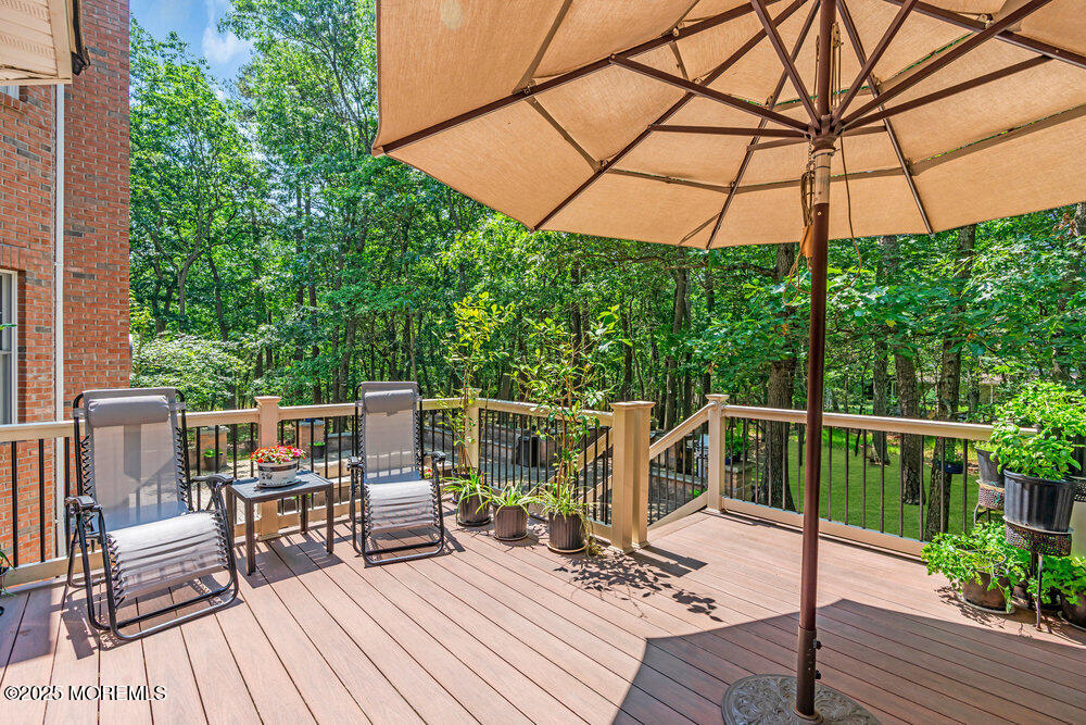312 Clearstream Road Jackson, NJ 08527 - Photo 82 of 99 a view of balcony with outdoor seating and wooden floor