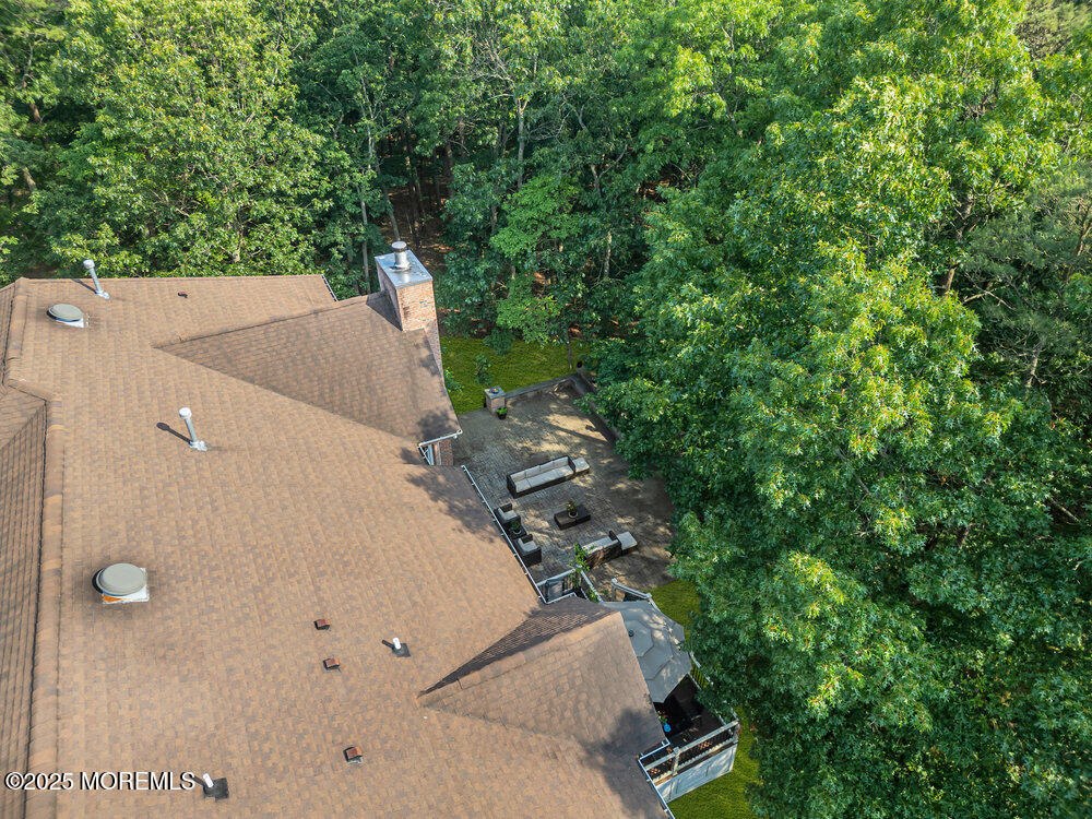 312 Clearstream Road Jackson, NJ 08527 - Photo 91 of 99 an aerial view of a house with a yard and trees
