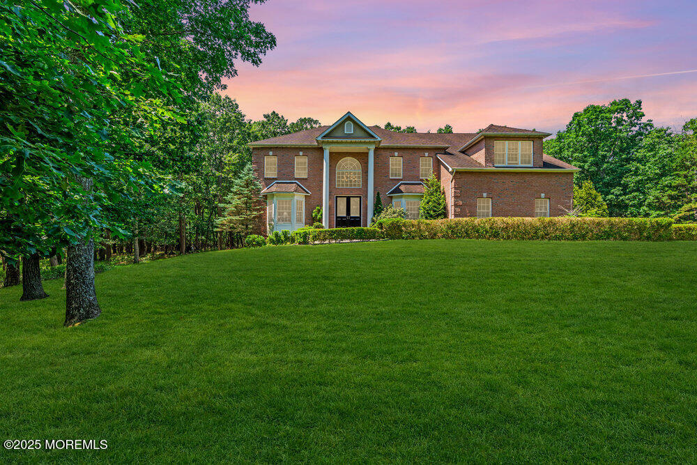 312 Clearstream Road Jackson, NJ 08527 - Photo 93 of 99 a front view of a house with a garden