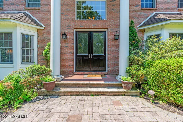 a dining room with furniture window and wooden floor