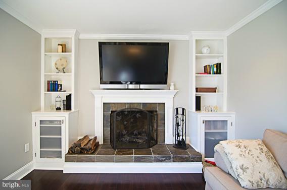 8469 Roberts Road Ellicott City, MD 21043 - Photo 8 of 30 Fireplace with slate surround and built-ins