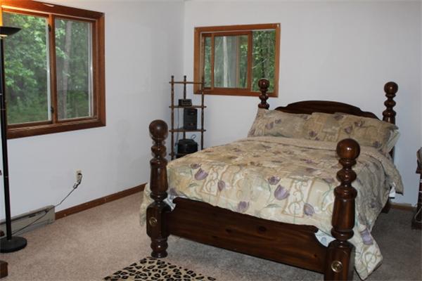 45 Squannacook Road Shirley, MA 01464 - Photo 5 of 8 a bed sitting in a bedroom next to a window