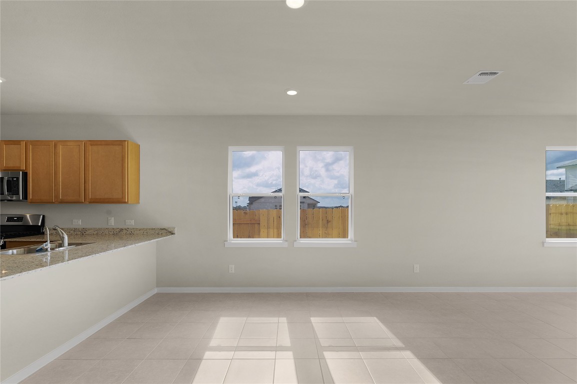 25624 Wheat Seed Lane Elgin, TX 78621 - Photo 19 of 40 a view of a kitchen with a sink and a window