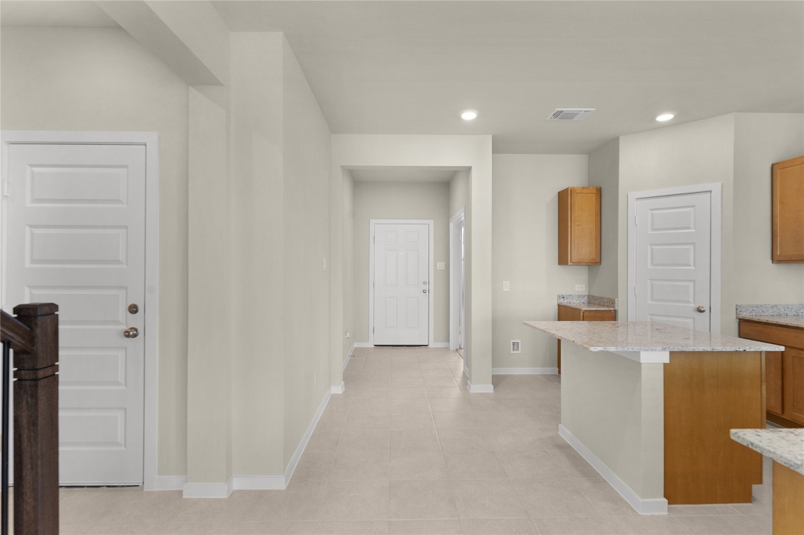 25624 Wheat Seed Lane Elgin, TX 78621 - Photo 23 of 40 a bathroom with a sink a toilet and mirror