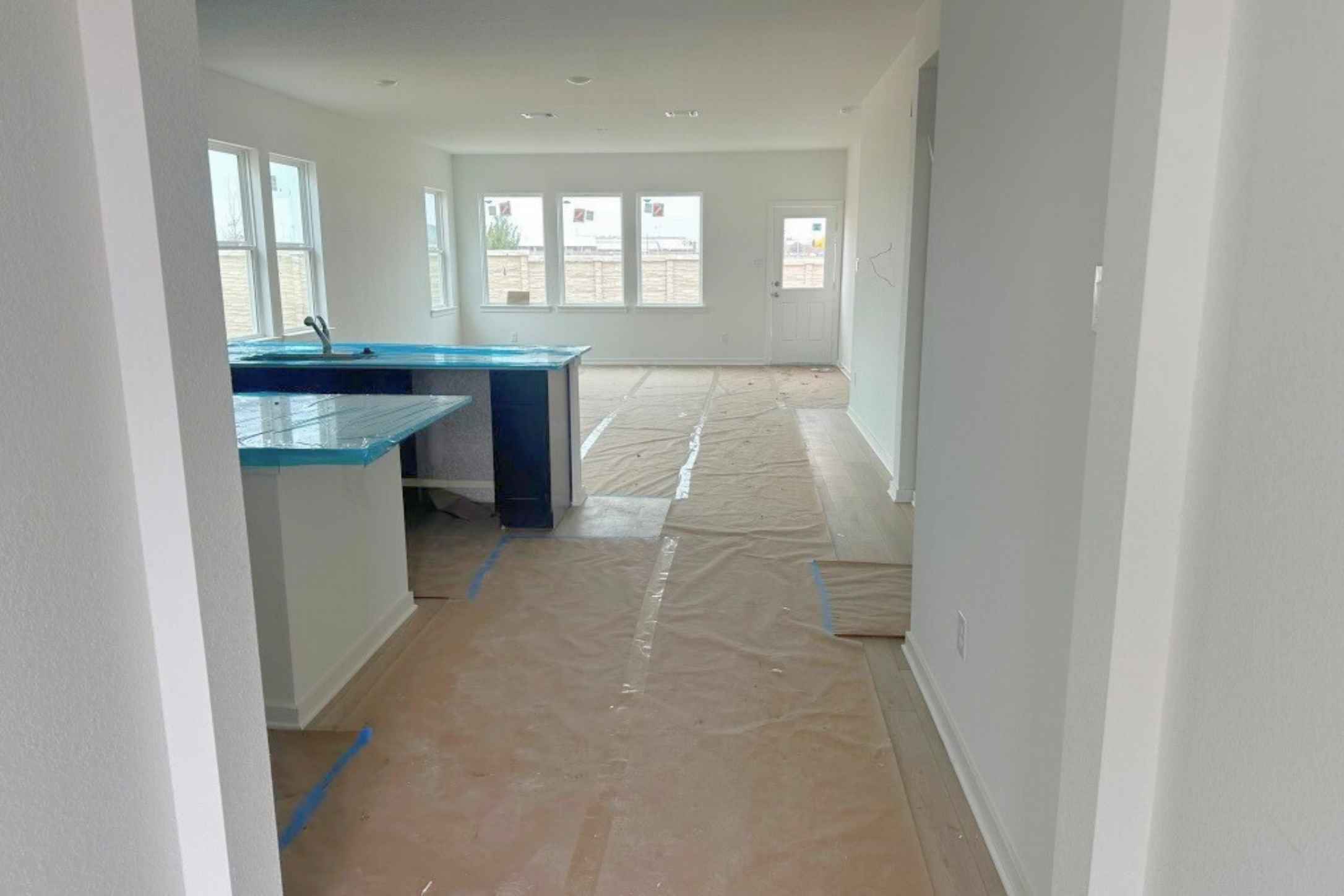 25624 Wheat Seed Lane Elgin, TX 78621 - Photo 2 of 40 Hall with baseboards and a sink