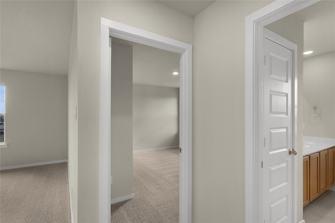25624 Wheat Seed Lane Elgin, TX 78621 - Photo 33 of 40 a view of an empty room with closet and a bathroom