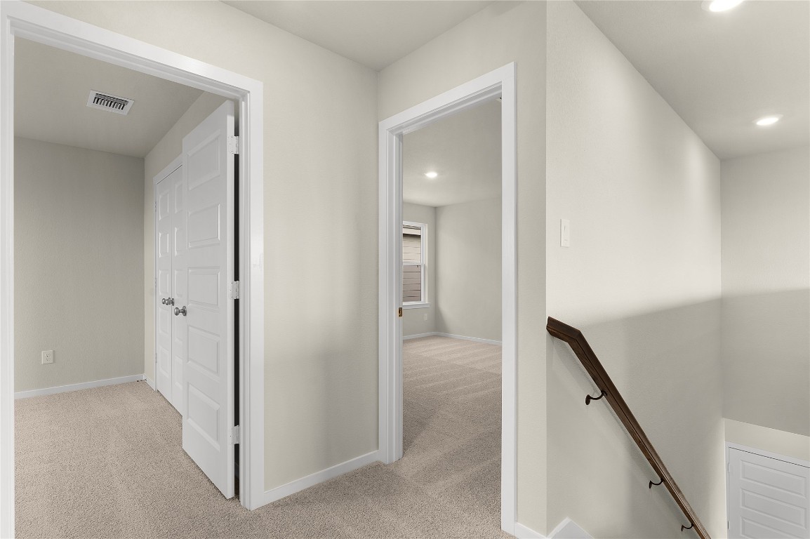 25624 Wheat Seed Lane Elgin, TX 78621 - Photo 36 of 40 a view of a hallway with a room and stairs