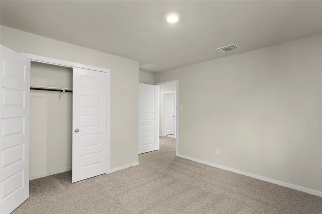 a view of a swimming pool with a patio and a garden