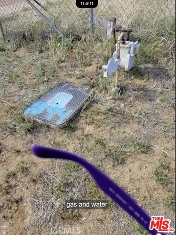 a wooden bench sitting in the middle of a yard