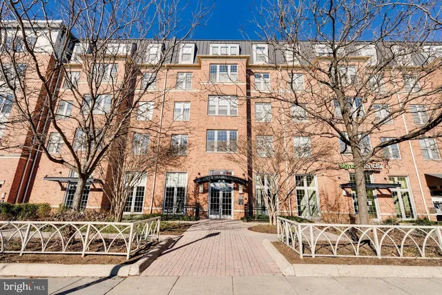 a building exterior with tall trees