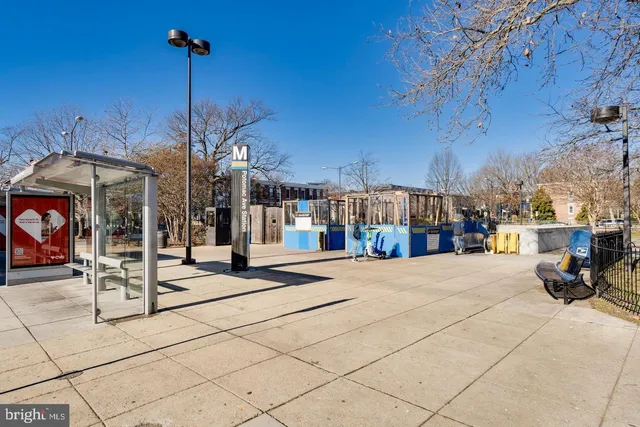 a view of a building with sitting area