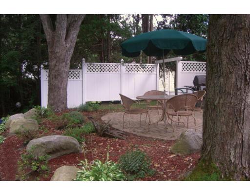 168 Birch Road Longmeadow, MA 01106 - Photo 12 of 13 a backyard of a house with table and chairs