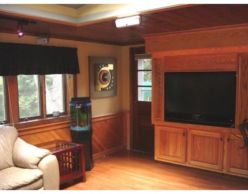 168 Birch Road Longmeadow, MA 01106 - Photo 5 of 13 a living room with a couch and a flat screen tv