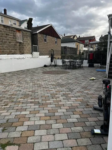 a front view of a house with parking area