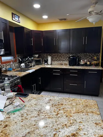 a kitchen with a sink and cabinets