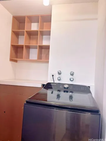 a room with a sink and cabinets