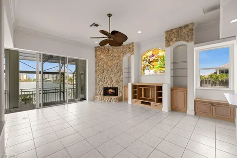a view of an empty room and fire place