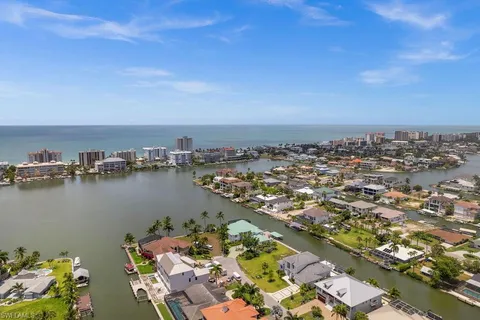 an aerial view of a house with a lake view