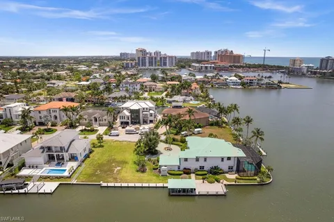 an aerial view of a house with a ocean view