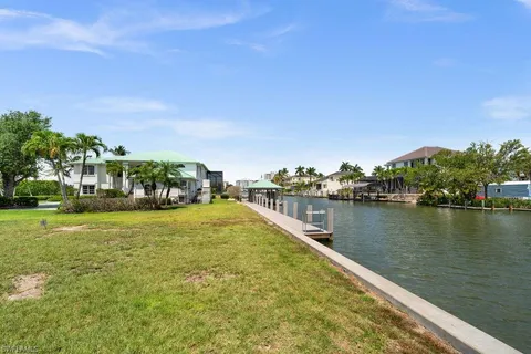 a view of a house with wooden deck