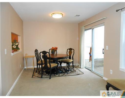 151 Woodbury Road Edison, NJ 08820 - Photo 3 of 15 a dining room with furniture and window